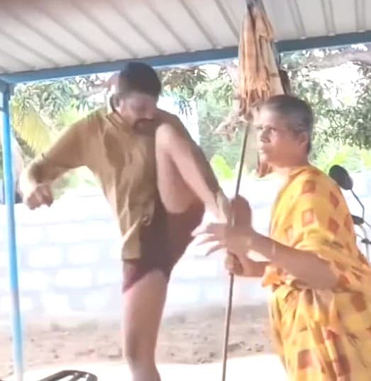 தாயை காலால் எட்டி உதைத்த மகன்